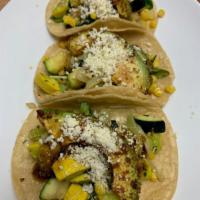 Vegetales Tacos · Zucchini, carrots, onions, peppers, salsa verde, cheese