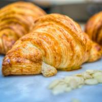 Almond Croissant · Handcrafted European butter croissant filled with smooth buttery lightly sweet almond cream....