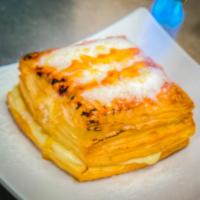 Creme Brulee Croissant · Indulge in the ultimate sweet treat: flaky croissant dough, filled and topped with rich hand...