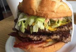 Double Monster Boyger · Homemade burger served with 1000 Island, lettuce, tomatoes, onions, pickles, relish and must...