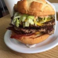 Double Monster Cheese Boyger · Homemade burger served with 1000 Island, lettuce, tomatoes, onions, pickles, relish and must...