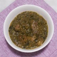 Saag Goat · Tender goat sauteed with fresh-chopped spinach and spices. Comes with basmati rice on the si...