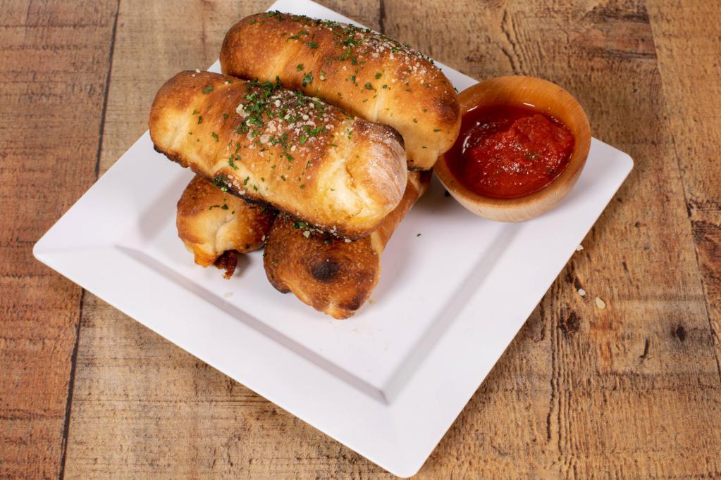 Pizza Rolls · Filled with pepperoni and mozzarella. Served with sauce.