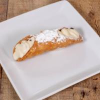 Cannoli · Sweet ricotta cream filled pastry and sprinkled with powdered sugar.