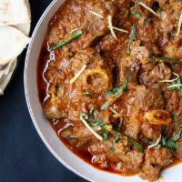 Karahi Gosht · Boneless pieces of lamb meat, spiced very mildly cooked in garlic and tomato gravy.