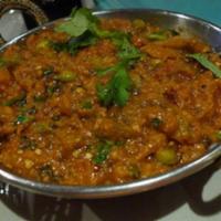 Baingan Bhartha · Fresh eggplant first roasted in clay oven(Tandoor) and cooked with onion , fresh tomatoes,he...