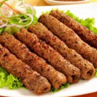 Sheesh Kabab · Minced lamb meat mixed with herb and spices, roasted to a perfect brown on skewers in our tr...