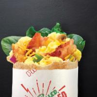 Awakin' with Bacon Pita · Bacon, eggs, grilled onions, grilled green peppers, spinach, hash browns, cheddar, salt and ...
