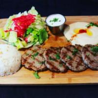 5. Kofte Kebab Plate · Charbroiled ground lamb and beef with herbs. Served with rice, salad, pita bread and hummus.