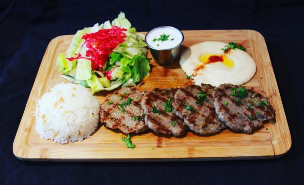 5. Kofte Kebab Plate · Charbroiled ground lamb and beef with herbs. Served with rice, salad, pita bread and hummus.