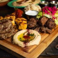 9. Mixed Grill Plate · Lamb and chicken shish kebab, kofta kebab, lamb, beef and chicken gyros. Served with rice, s...