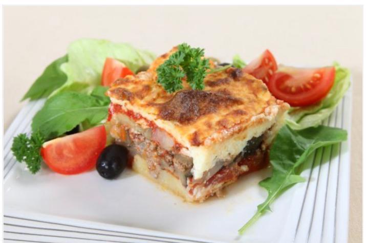 12. Musakka Plate · Layers of potato, ground lemon beef and eggplant, topped with bechamel sauce, marinara and cheese. Served with rice, salad, pita bread.