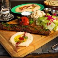 14. Adana Kebab Plate · Charbroiled grilled minced lamb and beef with parsley, red onion, and spices. Served with ri...