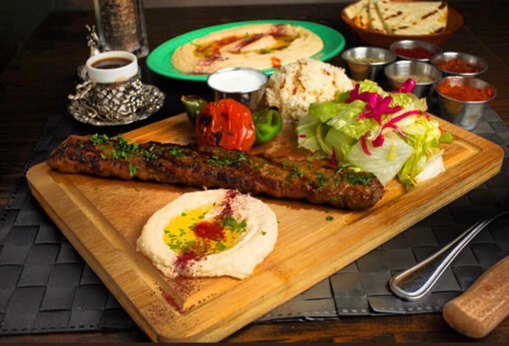 14. Adana Kebab Plate · Charbroiled grilled minced lamb and beef with parsley, red onion, and spices. Served with rice, salad, pita bread and hummus.
