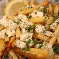 Feta Fries · French Fries topped with seasoning and feta cheese.
