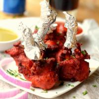 Chicken Lollipop · Deep fried chicken drumsticks in Indian herbs and spices.