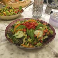 Mixed Green Salad · Mixed greens, tomatoes, carrots, cucumbers, red peppers and sliced avocado and. Served with ...