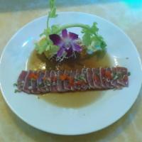 1. Tuna Tataki · Lightly seared tuna with salad and ponzu sauce.