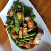 Pik Khing Crispy Pork Belly · Stir fried crispy pork belly in chilled paste, with green bean, basil, bell peppers.