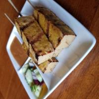 Tofu Satay · Tofu marinated in curry powder and grilled. Served with peanut sauce and cucumber salad.