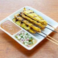 Chicken Satay · Chicken marinated in coconut milk and curry powder on a skewer. Served with peanut sauce and...