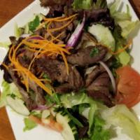 Beef Salad · Grilled beef sirloin with lettuce, tomatoes, cucumbers, onions, red onions, cilantro, lime j...
