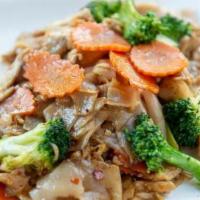 Pad See-Ew · Stir-fried wide rice noodles in black bean sauce with eggs, broccoli, carrots, and choice of...