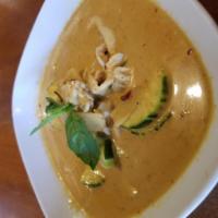 Red Curry · Red curry with coconut milk, basil, zucchini, bamboo shoots, bell peppers, and choice of mea...