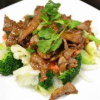 Pad Garlic · Choice of meat stir-fried with fresh garlic, black pepper, and mixed vegetables. Served with...