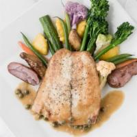 LAKE SUPERIOR WHITE FISH · Served with roasted potato petit legumes and lemon butter tomato capers sauce