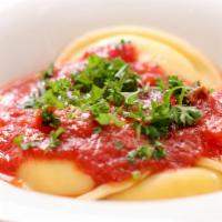 Ravioli · Ravioli stuffed with cheese or meat with marinara sauce and oven baked with mozzarella.