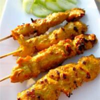 Satay · Three pieces of chicken or beef skewer with peanut sauce.