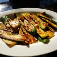 Flamed Grilled Zucchini · Fresh sliced Zucchini charbroiled and accented with extra virgin olive oil, Modena balsamic ...
