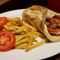 Chicken Kabob Pita · Marinated chicken breast wrapped in a pita, served with tomatoes, red onions, and House made...