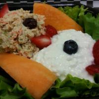 Tuna Boat Salad · Albacore tuna and Cottage cheese with cucumber, black olives and garnished with fruit.