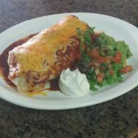 Chile Colorado Burrito · Dry burrito with beef simmered in enchilada sauce. Ed with rice and beans. Guacamole and sou...