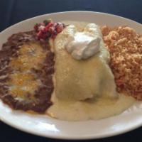 Seafood Enchiladas · Corn tortillas filled with grilled fish and shrimp. Topped with a homemade Alfredo sauce, me...