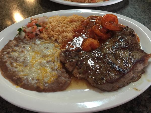 New York Steak · Served with rice and beans.