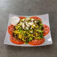 Greek Salad · Gyro meat, lettuce, tabouli, yellow rice, feta cheese, tomatoes, chopped green onions and tz...