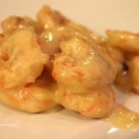 Coconut Shrimp · Marinated Shrimp Deep Fried With seasoned Chickpea Flour. Served in a blanket of a coconutty...