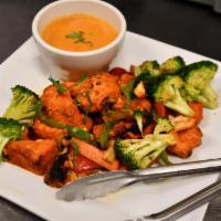 Chicken Tikka · The white meat version of Tandoori Chicken, Chicken Tikka is chicken breast prepared by roas...