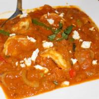 Shrimp Bhuna · A fairly dry fried curry containing Jumbo Shrimp, onion, bell peppers, and around a dozen In...