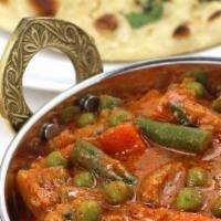 Vegetable Curry · Garden fresh vegetables cooked with onions, tomato, garam masala and ginger garlic paste. Se...