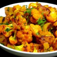 Aloo Gobi · Cauliflower and potatoes cooked with onions, spices and tomatoes.