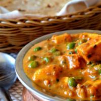 Mutter Paneer · Mutter Paneer is a dish of homemade cheese and green peas cooked in a savory cream sauce. (GF)