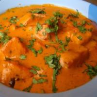 Paneer Makhani · A blend of yogurt, spices marinated paneer dressed in a velvety red bath composed of a butte...