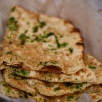 Naan · Naan, the most popular Indian bread. Baked in the clay oven; tandoor, tastes HEAVENLY. The t...