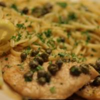 Chicken Picatta Dinner · Boneless chicken breast dipped in flour and egg cooked in butter, capers, lemon, and white w...