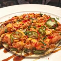 Chirashi Pizza · Crispy tortillas, spicy tuna, assorted fish, avocado, scallion and tobiko with chef creamy s...