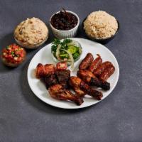 Combination plate · 2 chicken leg, 2 chicken kabob, 2 beef kabob, basmati rice, grilled tomato, Brazilian black ...